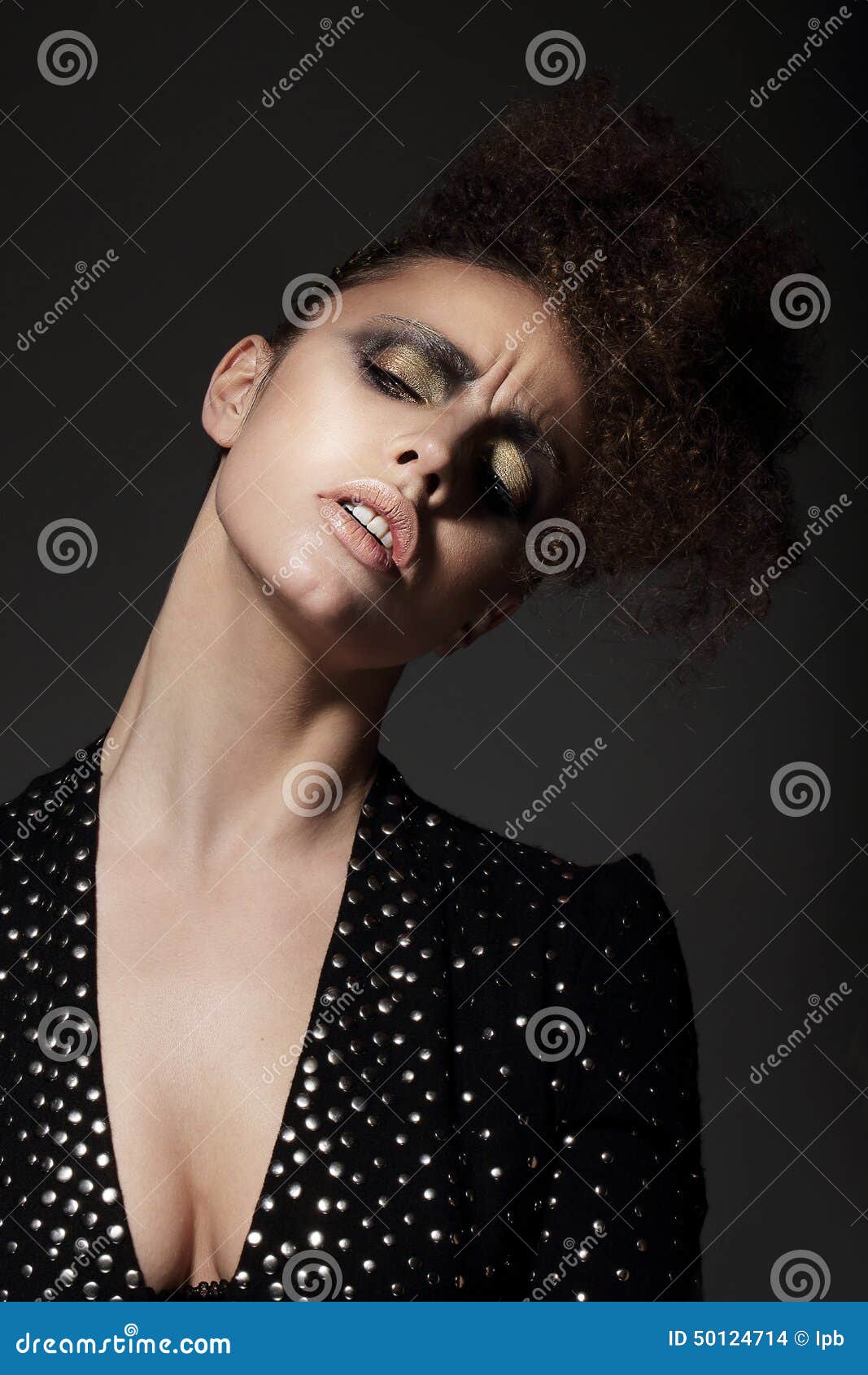 charming lady with golden eyeshadow in reverie