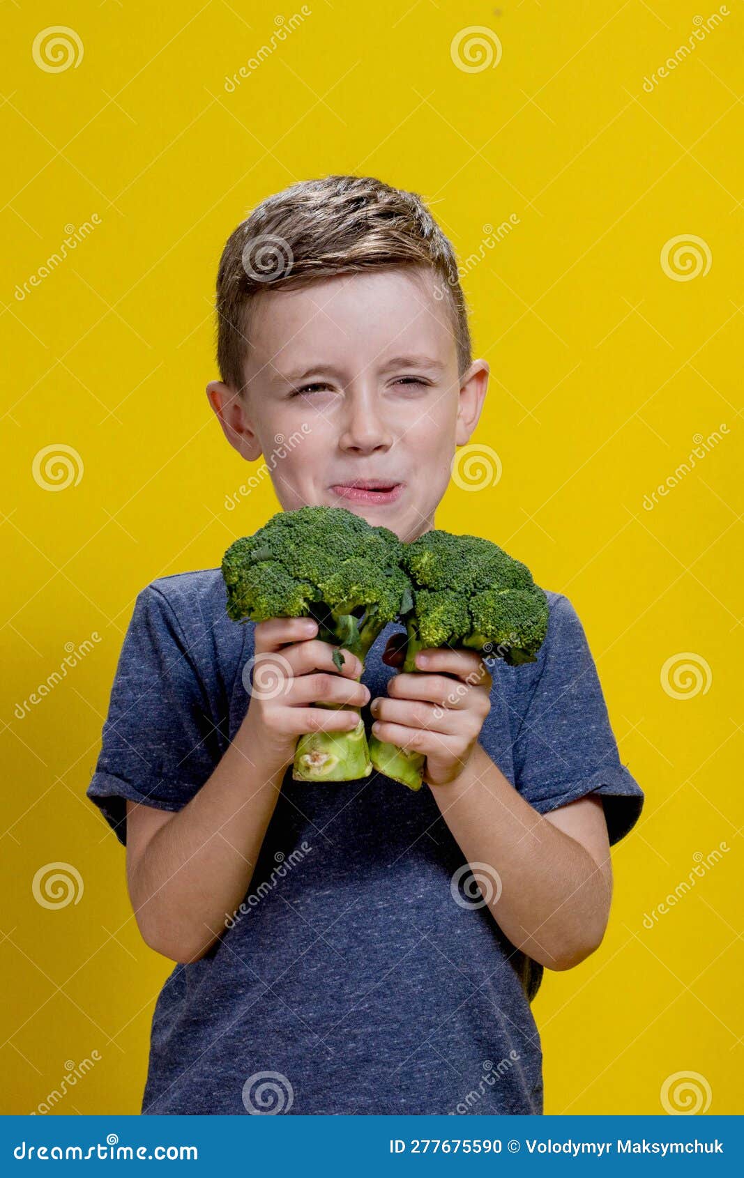A Charming Little Boy Refusing To Eat Broccoli. Brootish Broccoli Stock