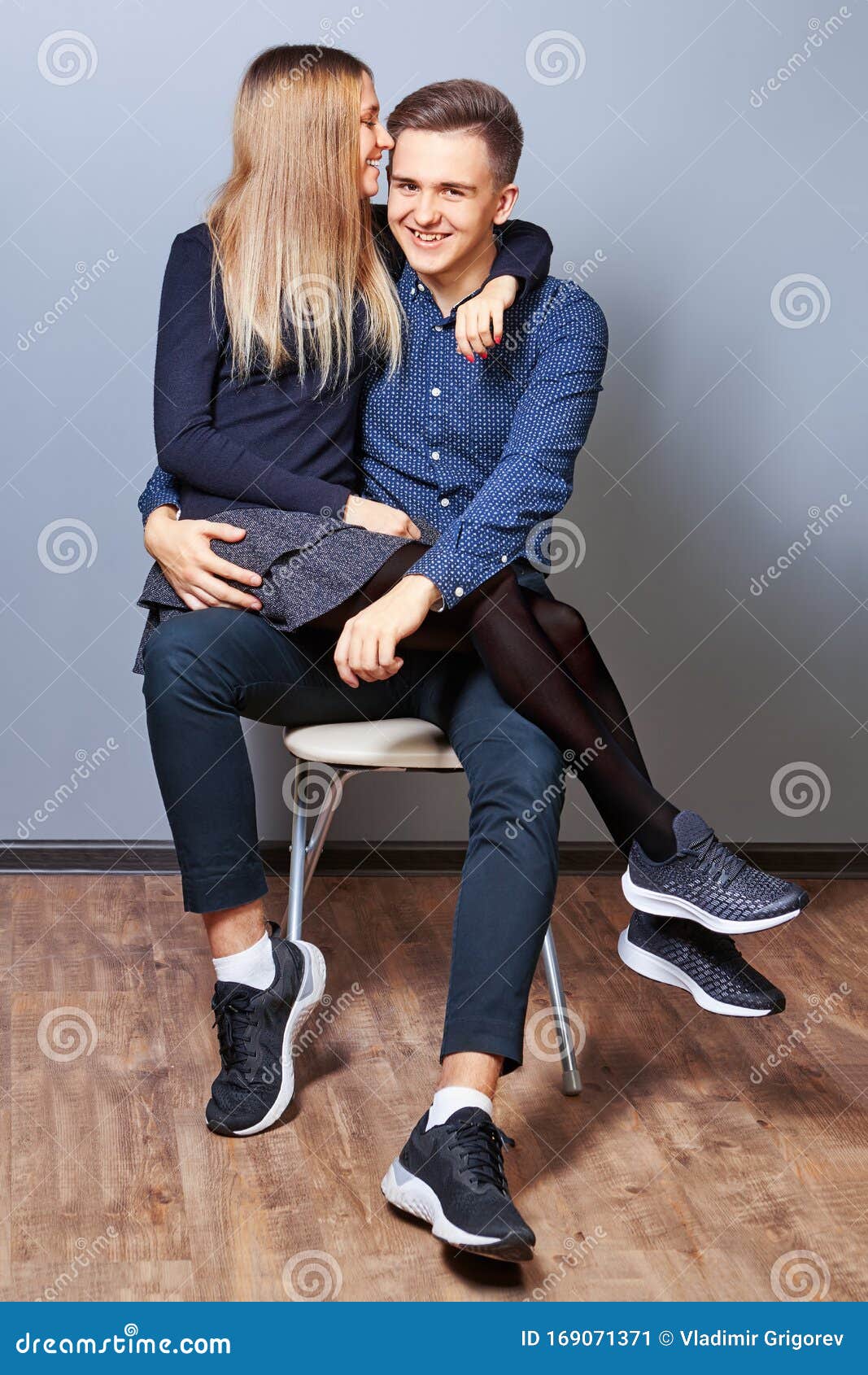 Girl Sitting On Boy Lap