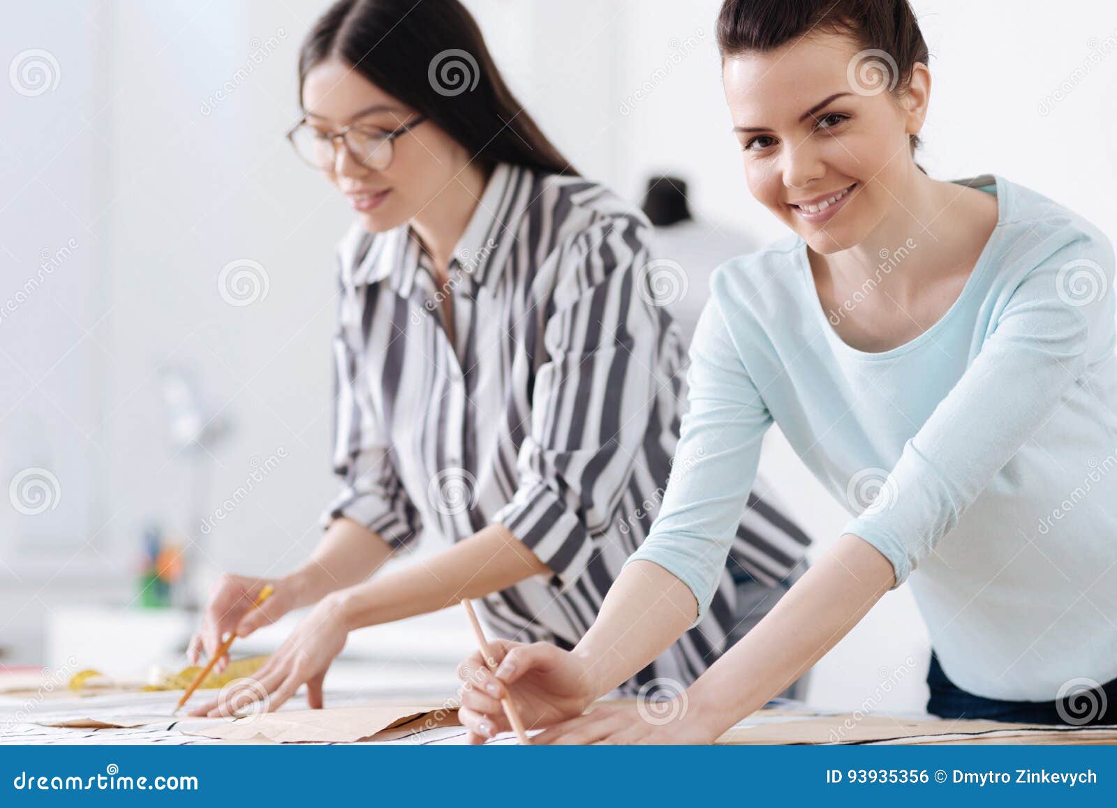 Charming Smiling Women Tracing Patterns on Fabrics Stock Photo - Image ...