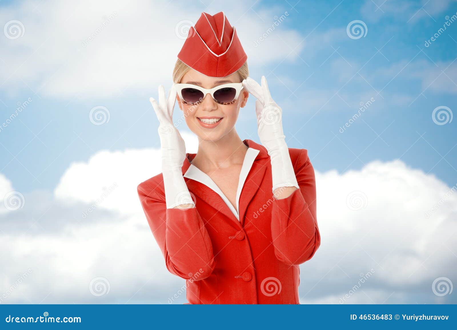 charming stewardess in red uniform and vintage sunglasses