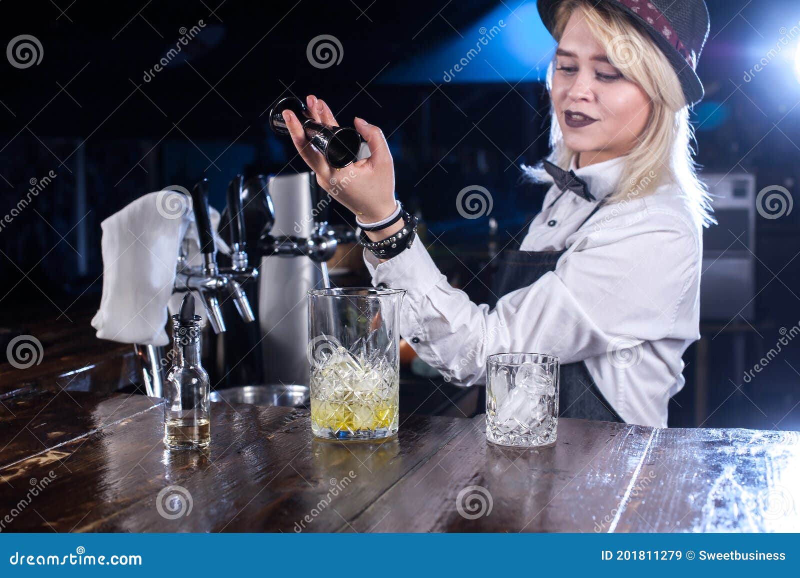 Charming Woman Mixologist Mixes a Cocktail at the Bar Counter Stock ...