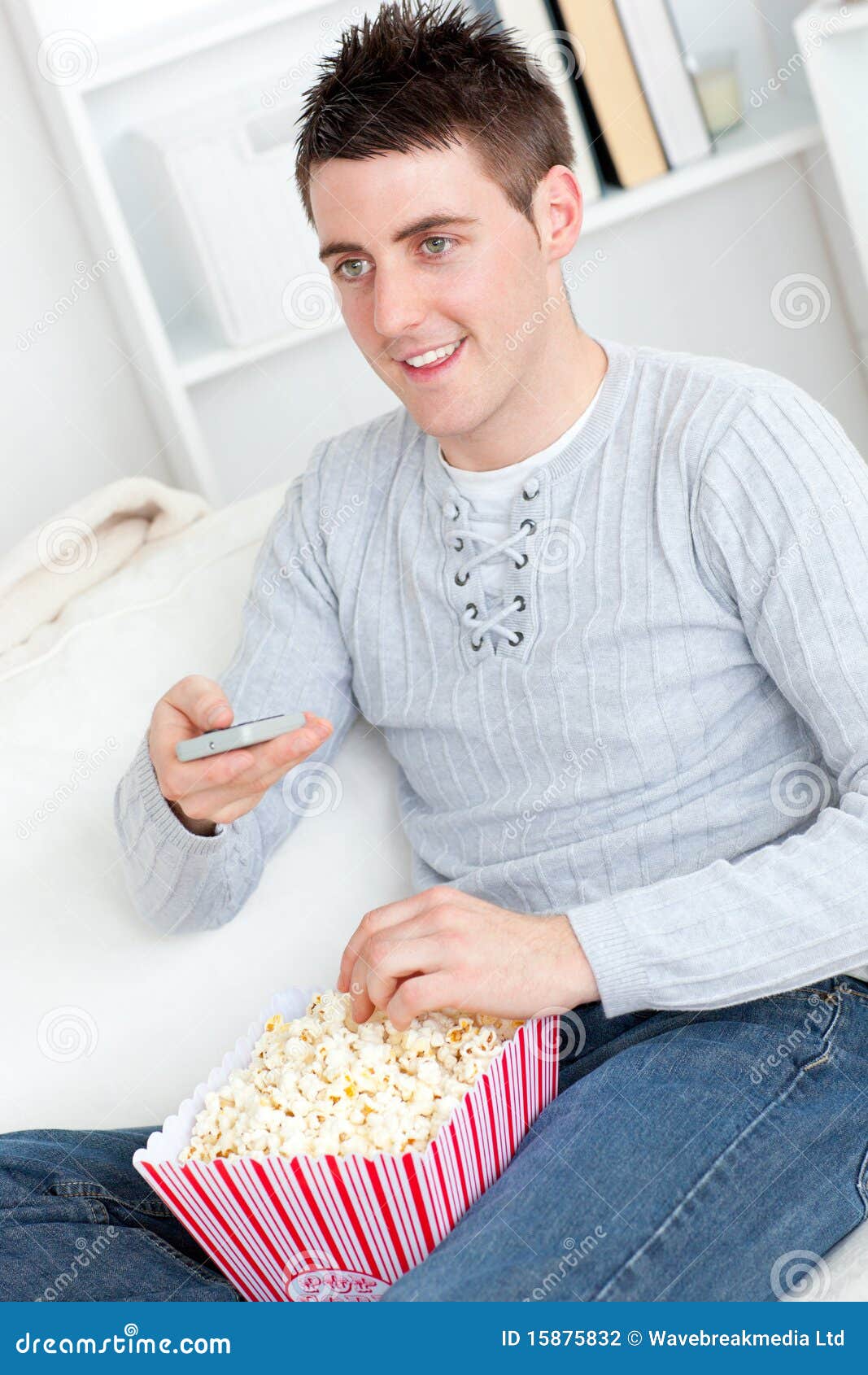 Charming Young Man Eating Popcorn and Watching Tv Stock Photo Image