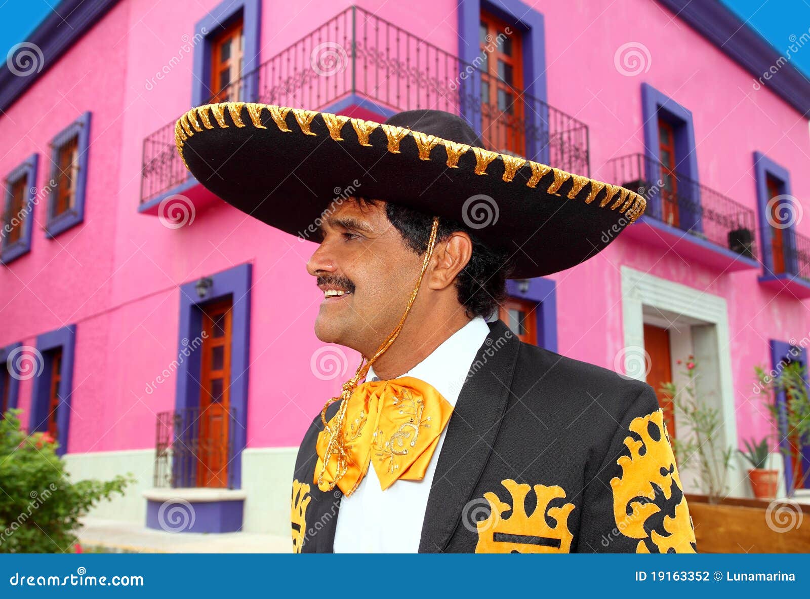 charro mexican mariachi portrait in pink house