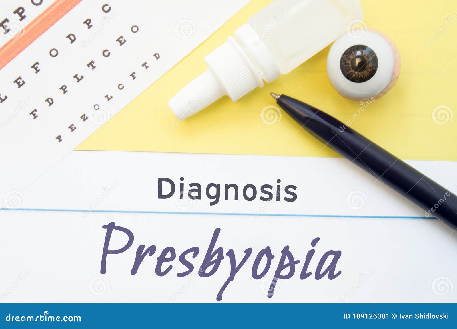 chart for testing visual acuity, eye drops and eye anatomical model lies next to inscription diagnosis presbyopia. concept for dia