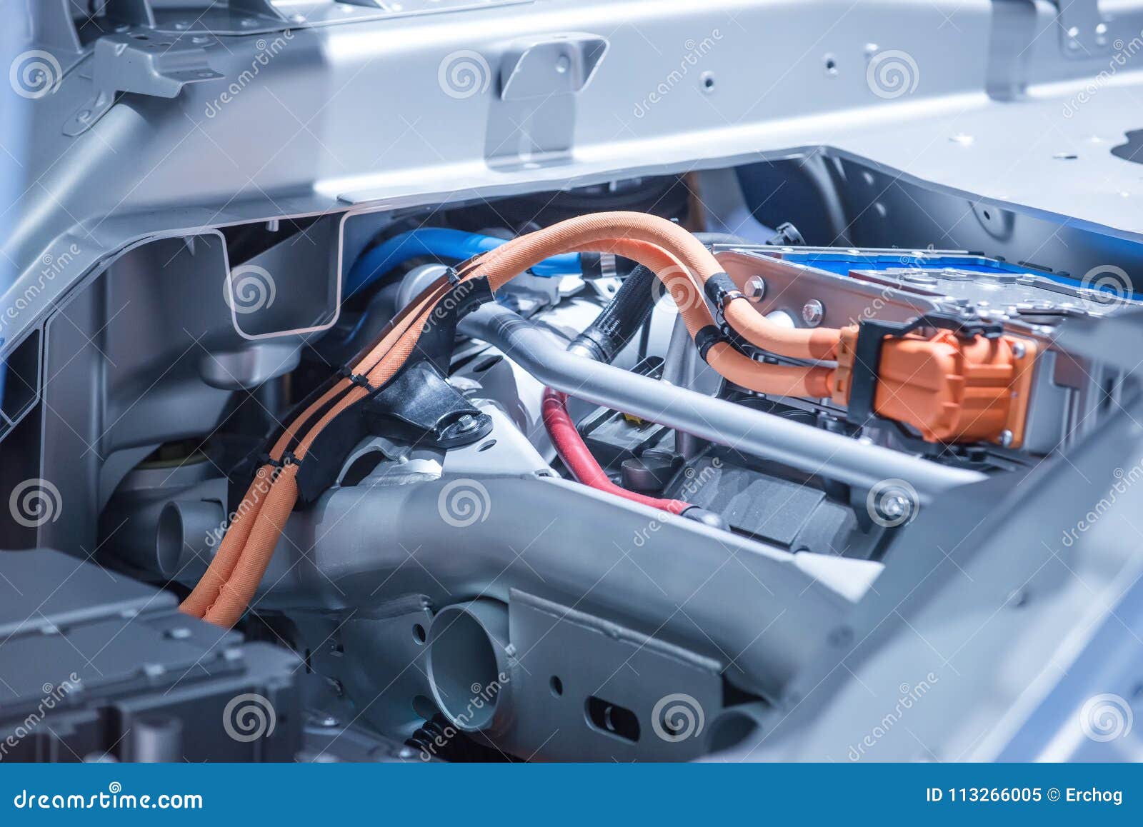 chassis of the electric car with powertrain and power connections closeup. blue toned.