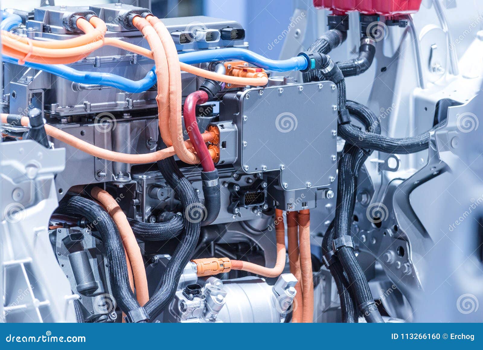 chassis of the electric car with powertrain and power connections closeup. blue toned.