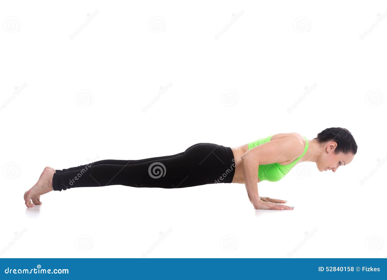 Woman yoga trainer doing a variation of Chaturanga Dandasana (four-limbed  staff) pose Stock Photo - Alamy