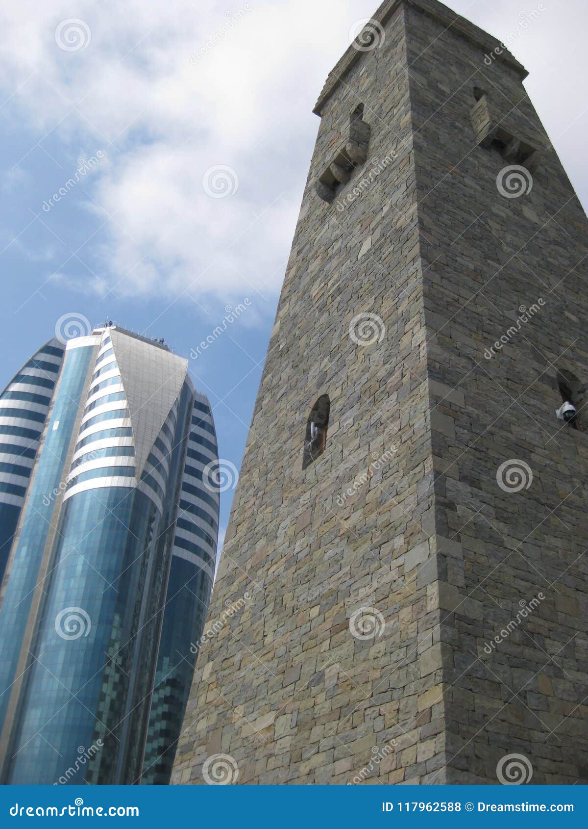 Chechen Battle Tower Vainakh In The Center Of Grozny Against The Blue Sky And A Modern High Rise Building Stock Photo Image Of Photographed Center Chechen Battle Tower Vainakh In The Center Of Grozny Against The Blue Sky And A Modern High Rise Building Stock Photo Image Of Photographed Center