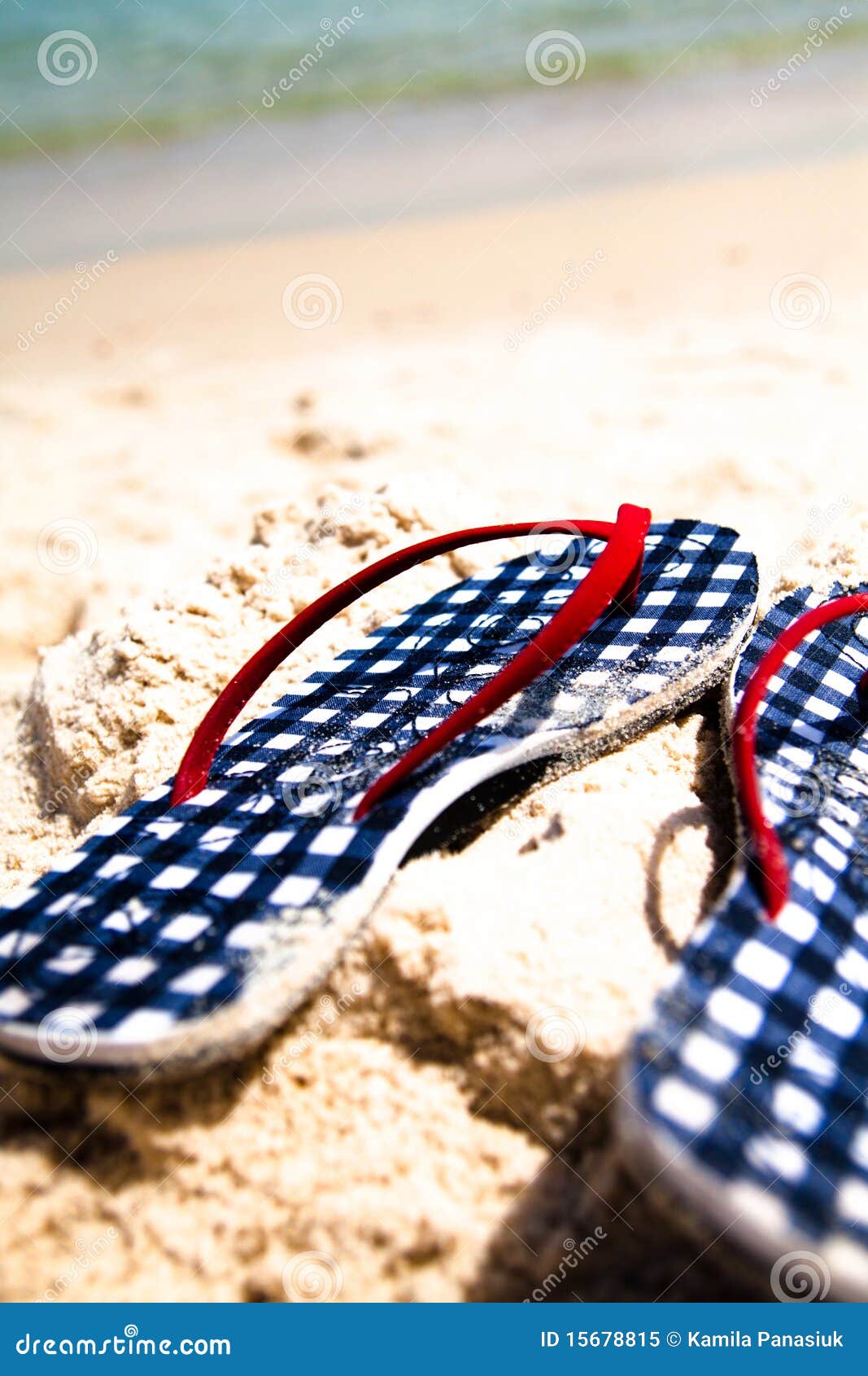 checked flip-flops on the beach