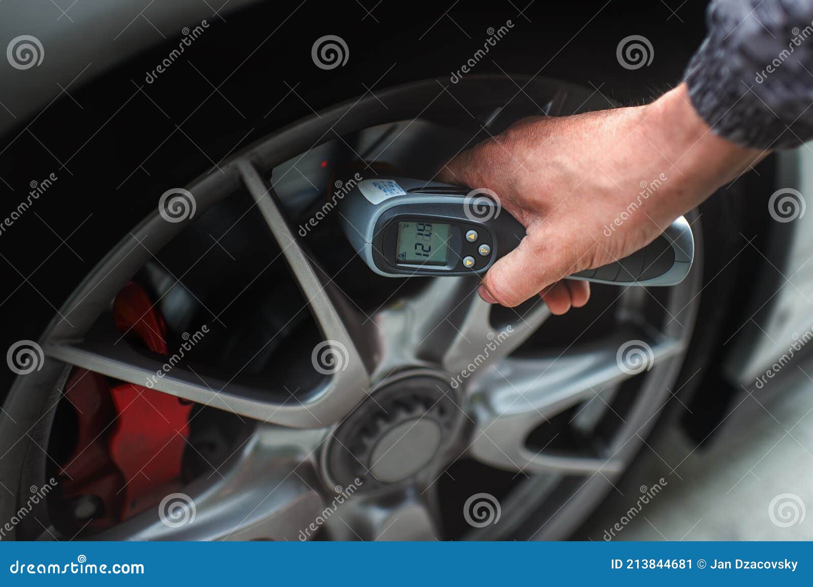 Checking the Car Brake Disc Temperature Using a Digital Thermometer