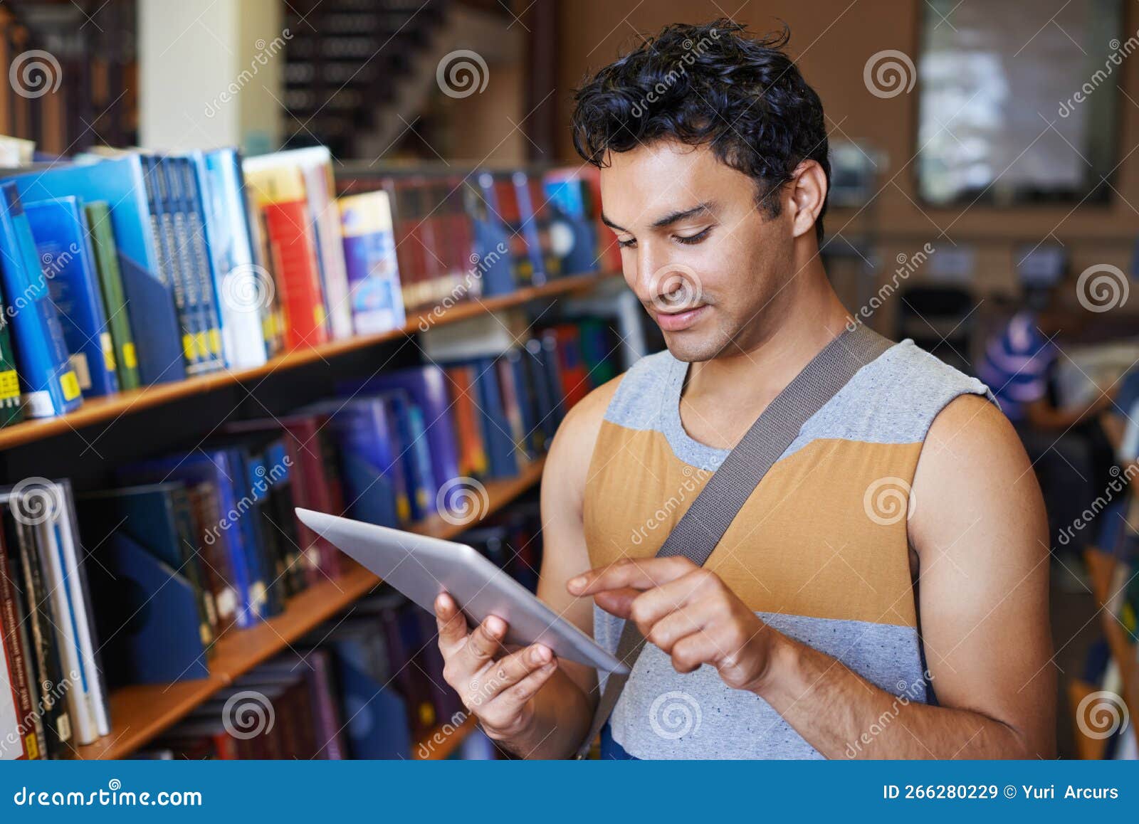 Checking the List of Study Material on His Digital Tablet. a Handsome