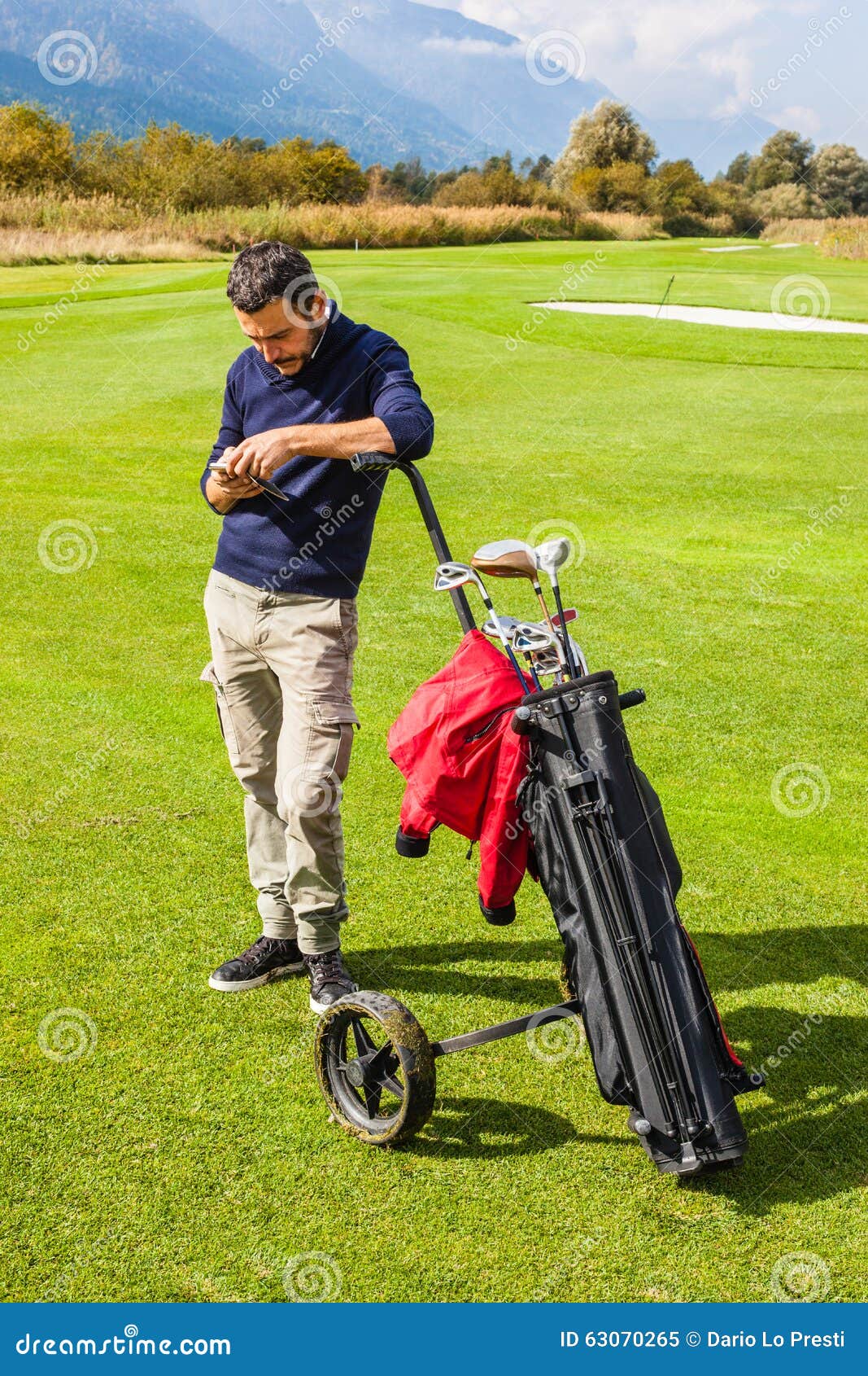Checking Messages on the Golf Course Stock Image Image of caucasian