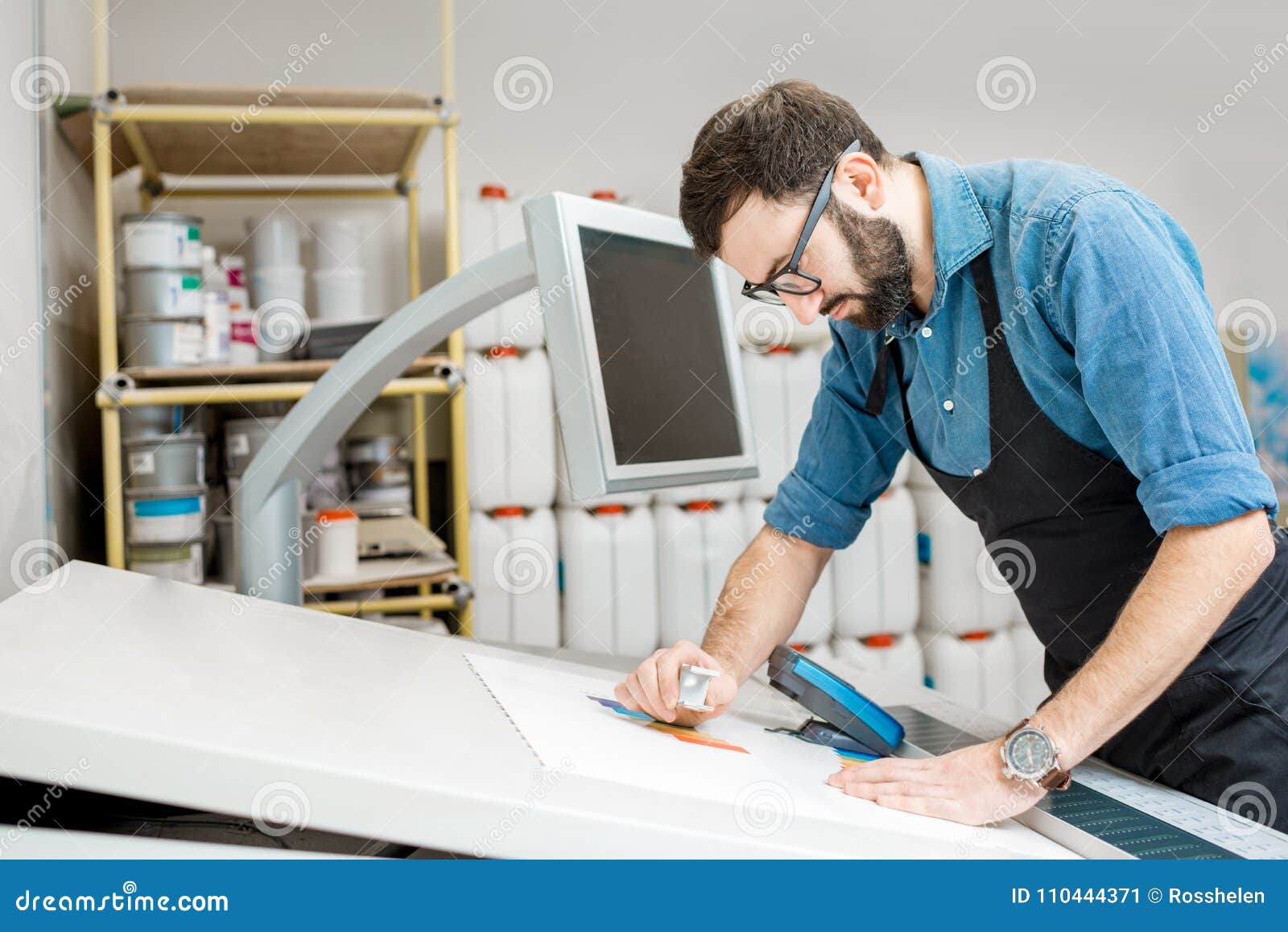 Checking the Quality of the Printing with Magnifying Glass Stock Image