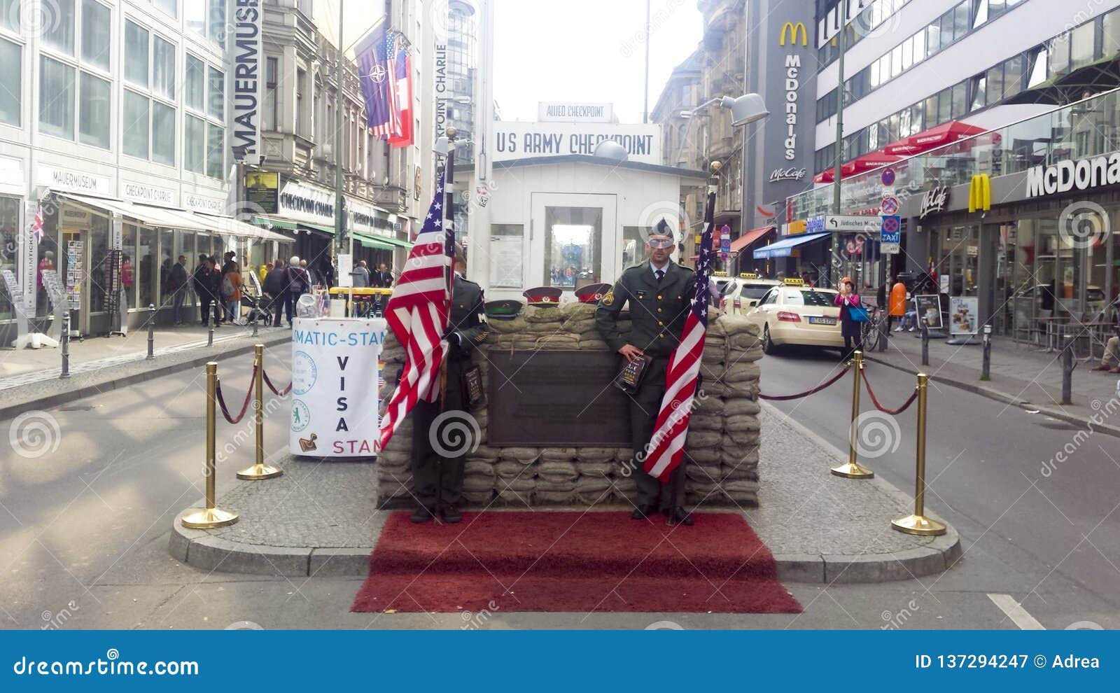 troops with usa flag on the american part of checkpoint charlie