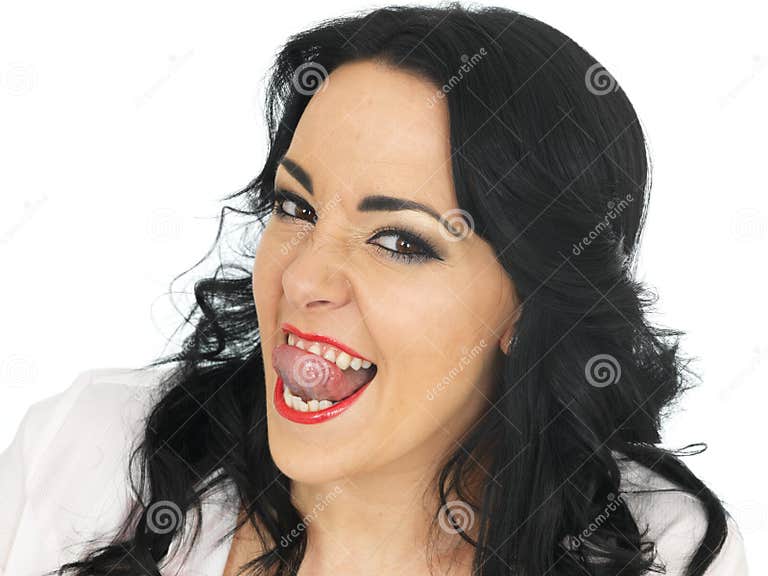 Cheeky Beautiful Young Hispanic Woman Pulling Silly Faces And Sticking Tongue Out Stock Image 