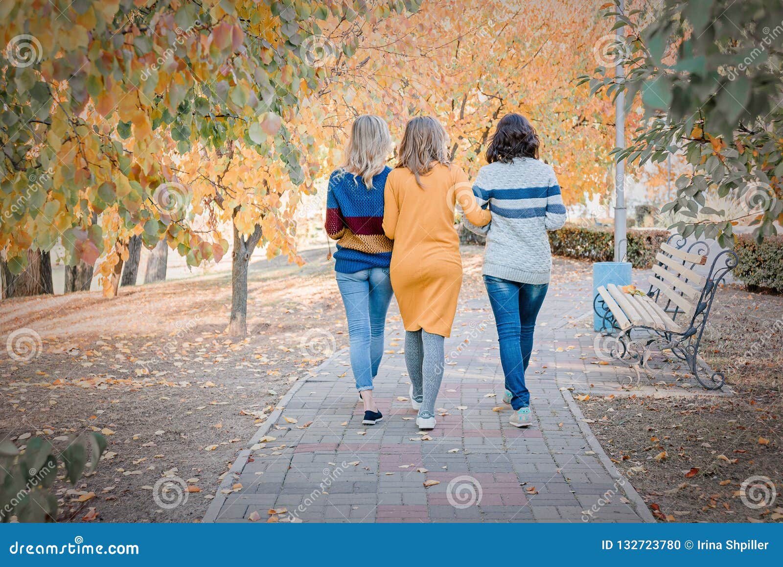 Cheerful Attractive Three Young Women Best Friends Walking And Having