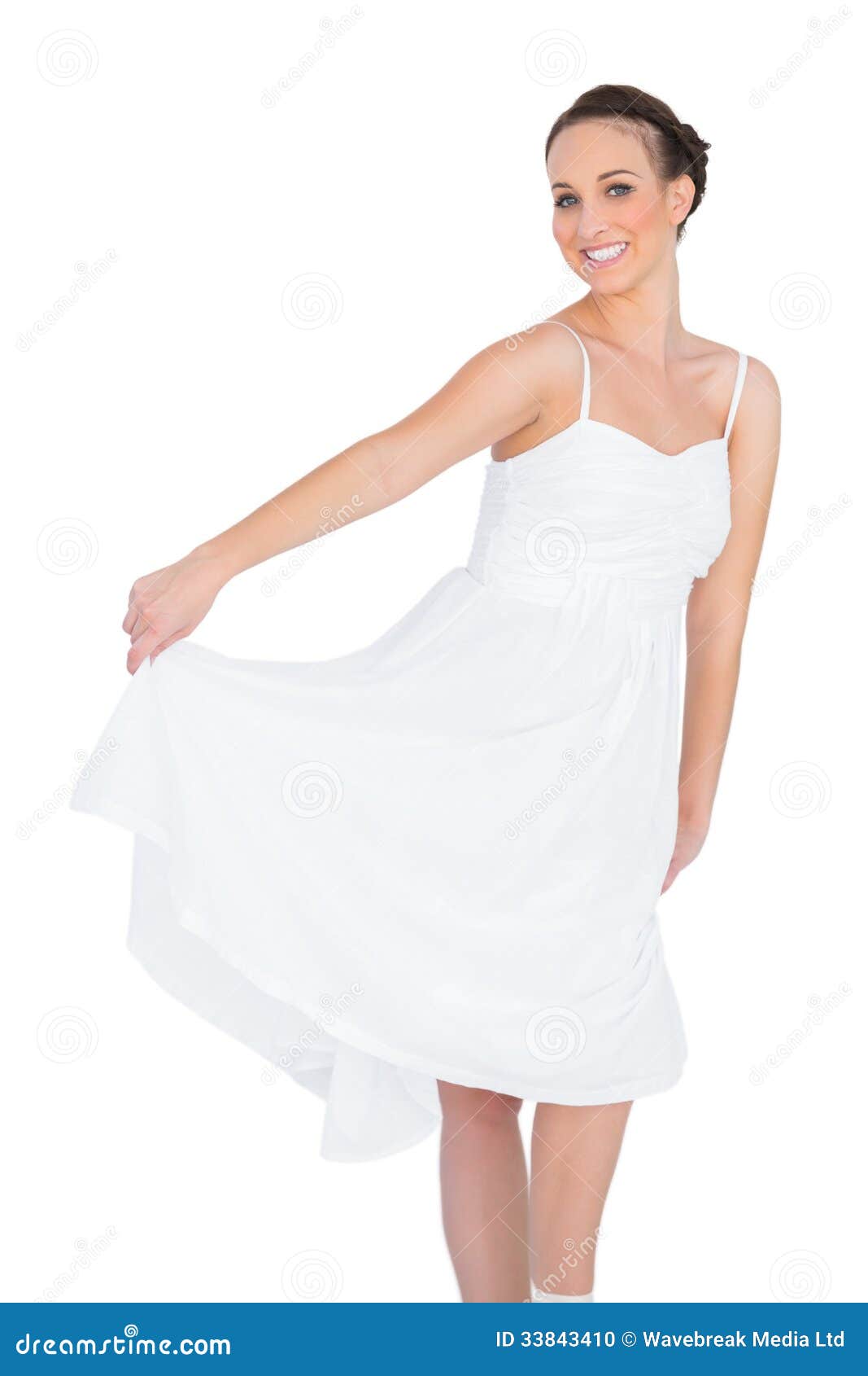 Cheerful Beautiful Young Model in White Dress Dancing Stock Photo