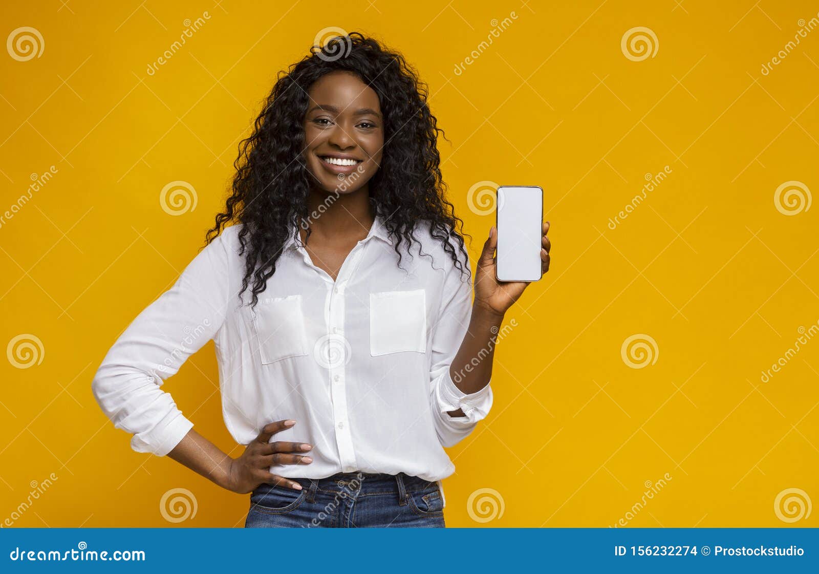 cheerful black woman showing latest slim cellphone