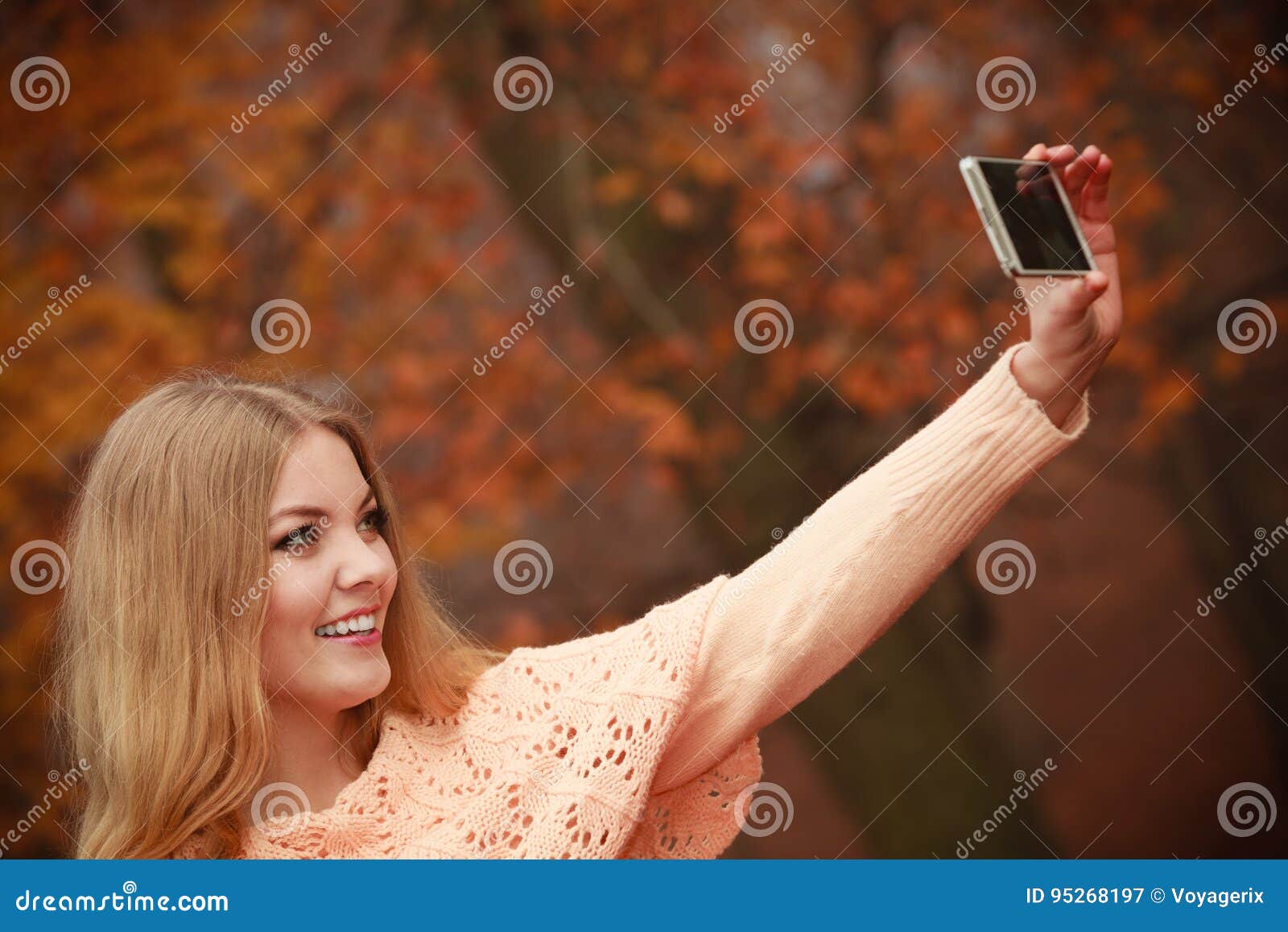 Blonde girl taking a selfie with her hair down - wide 10