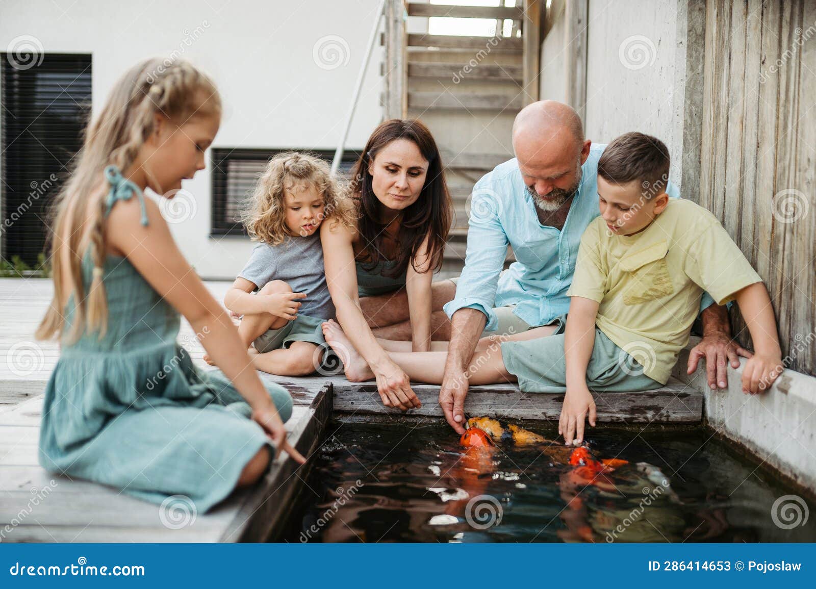 Cheerful Family with Three Kids Taking Care of Fish in Pond. Stock Image -  Image of beautiful, outdoor: 286414653