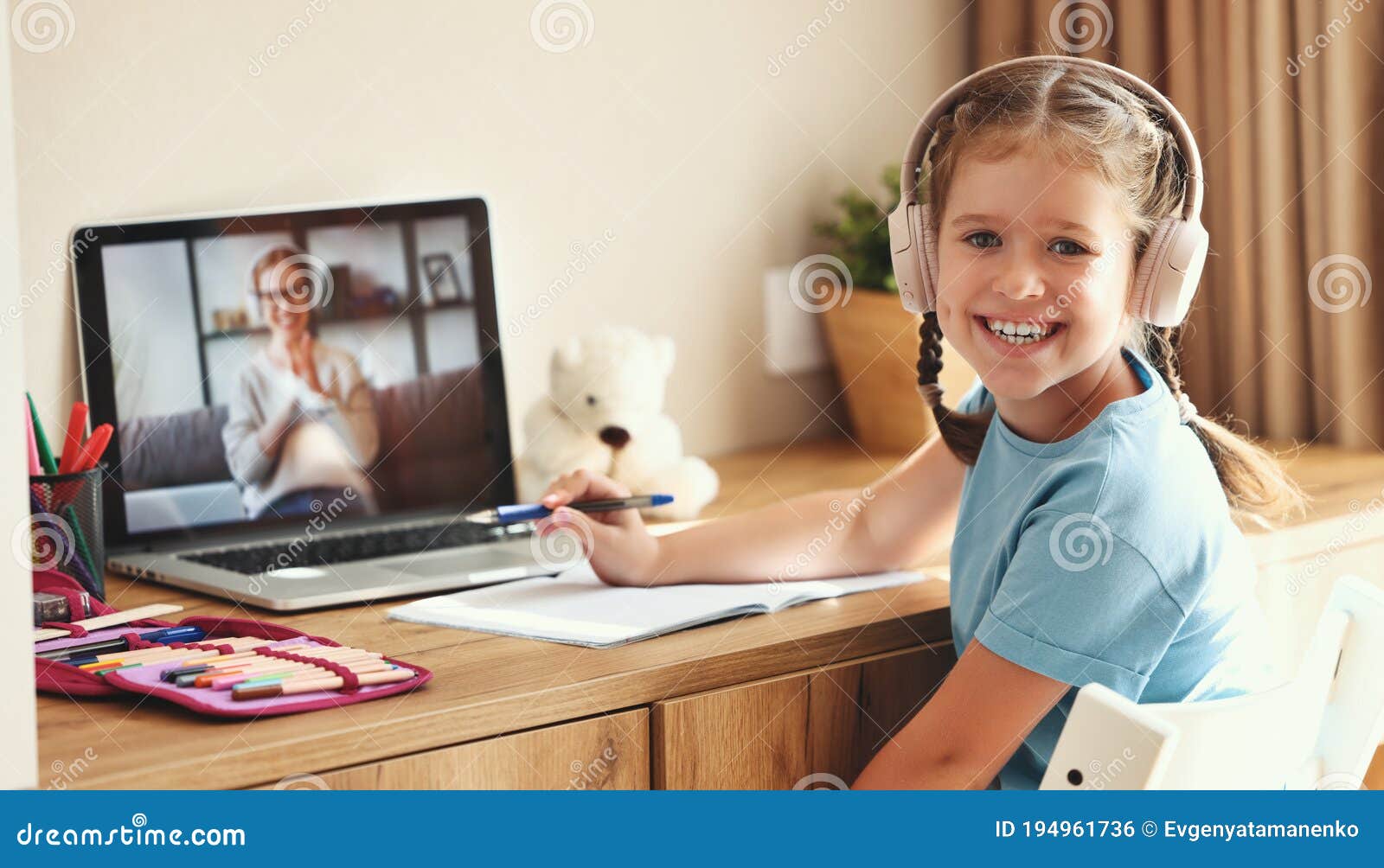 cheerful girl during online lesson at home