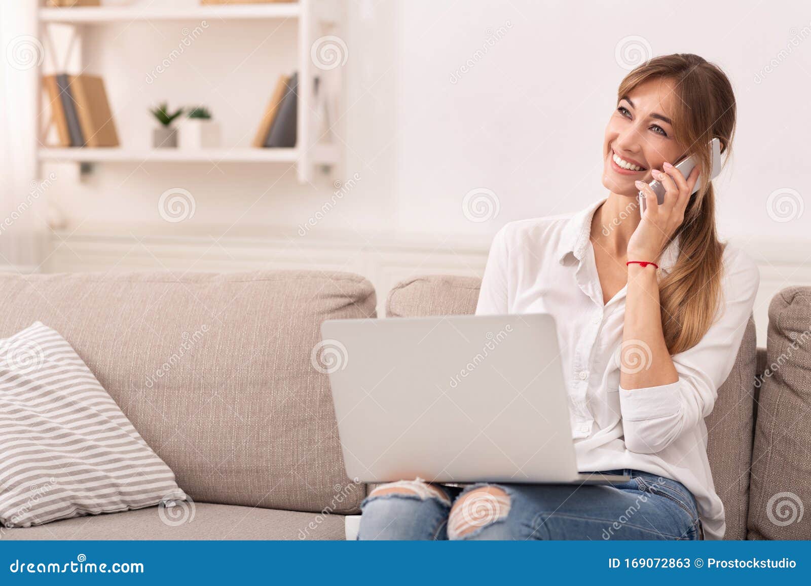 Cheerful Girl Talking on Phone Sitting with Laptop Indoor Stock Image ...