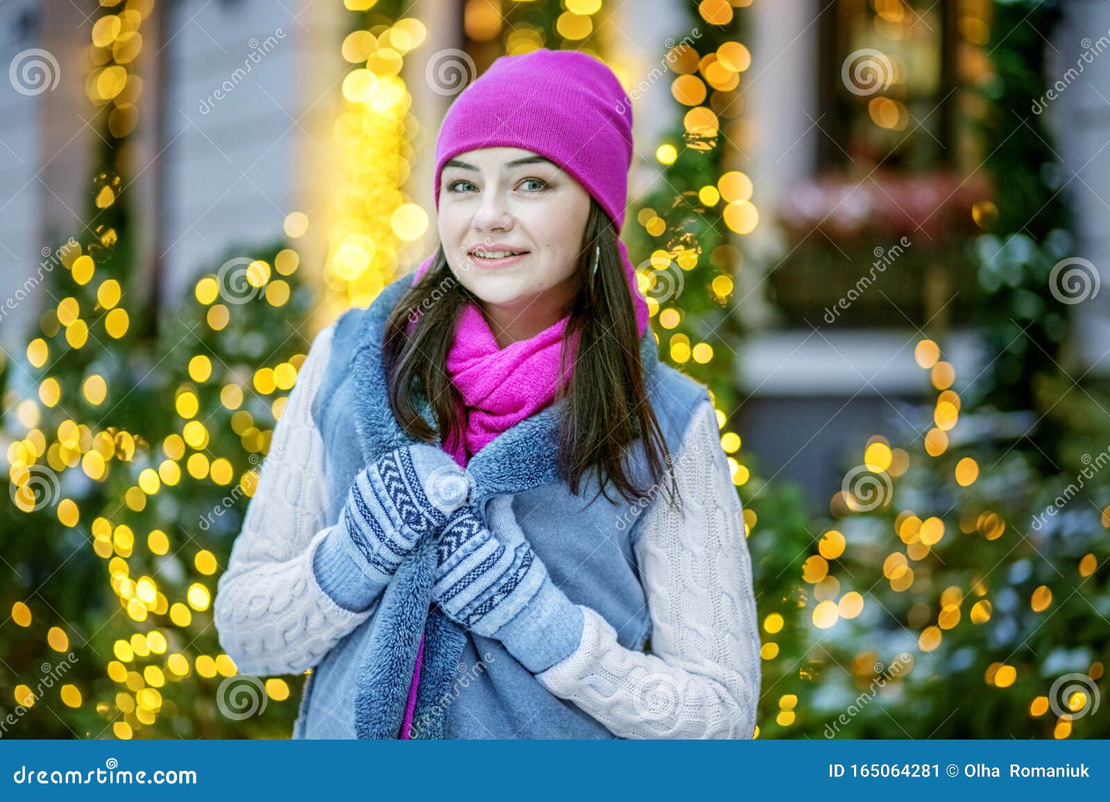 A Cheerful Girl Walks Along the Street at Christmas. Concept Lifestyle ...