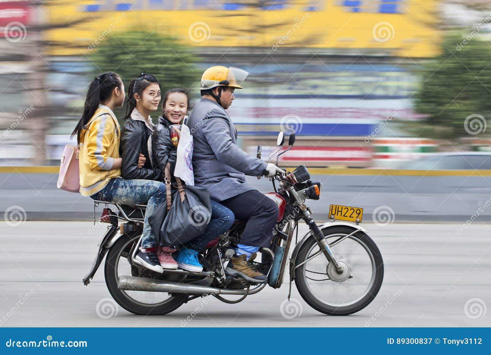 Cheerful Girls On A Motor Taxi In Guangzhou China  