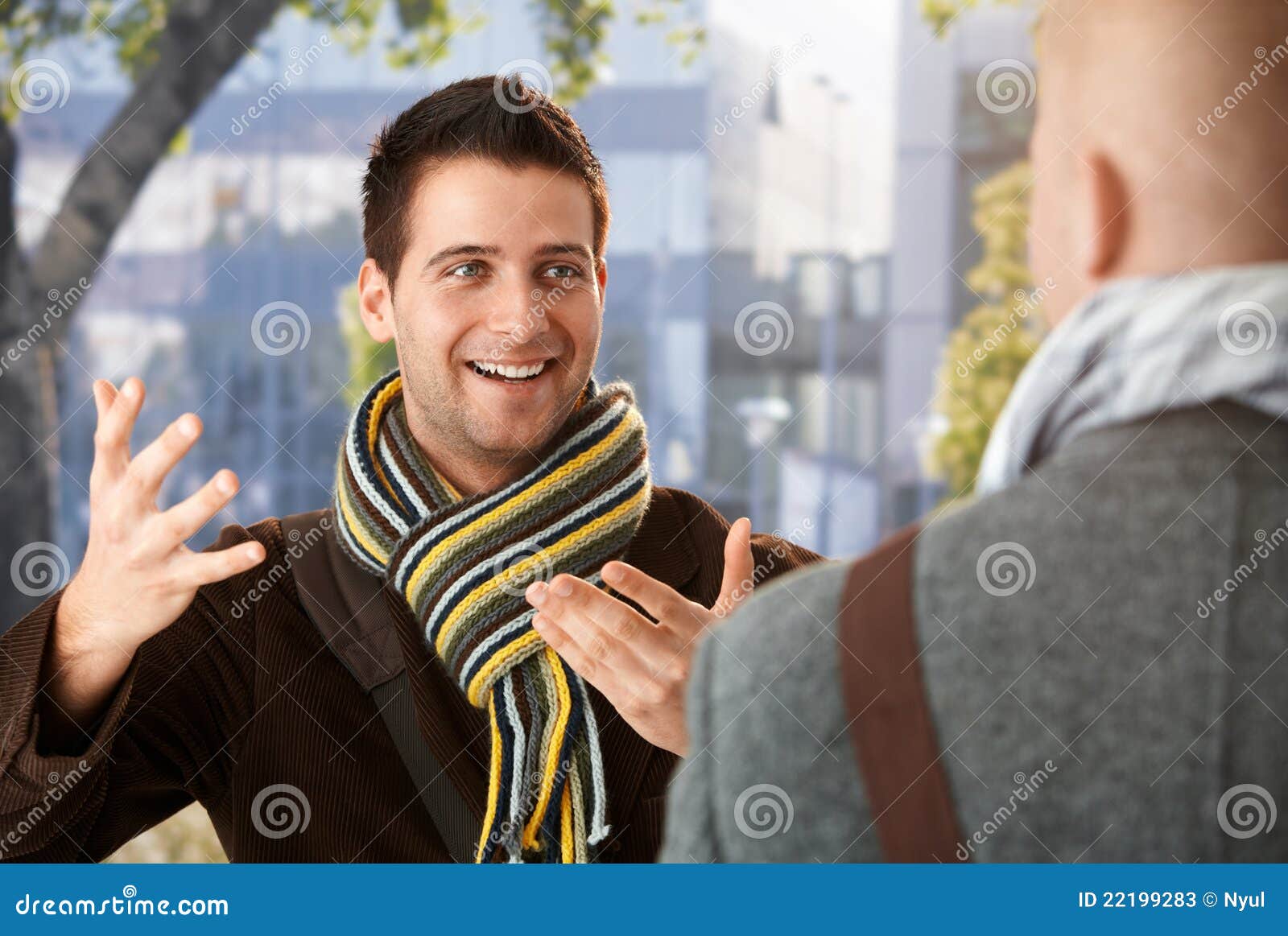cheerful guy gesturing to friend