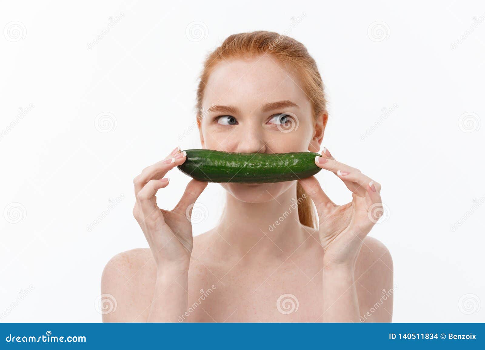 Cheerful Happy Beautiful Girl With Cucumber On Her Hand Isolated On