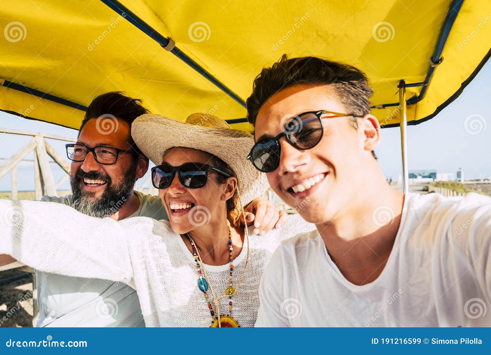 cheerful happy family have fun together in outdoor leisure activity laughing and smiling - concep tof summer holiday vacation for