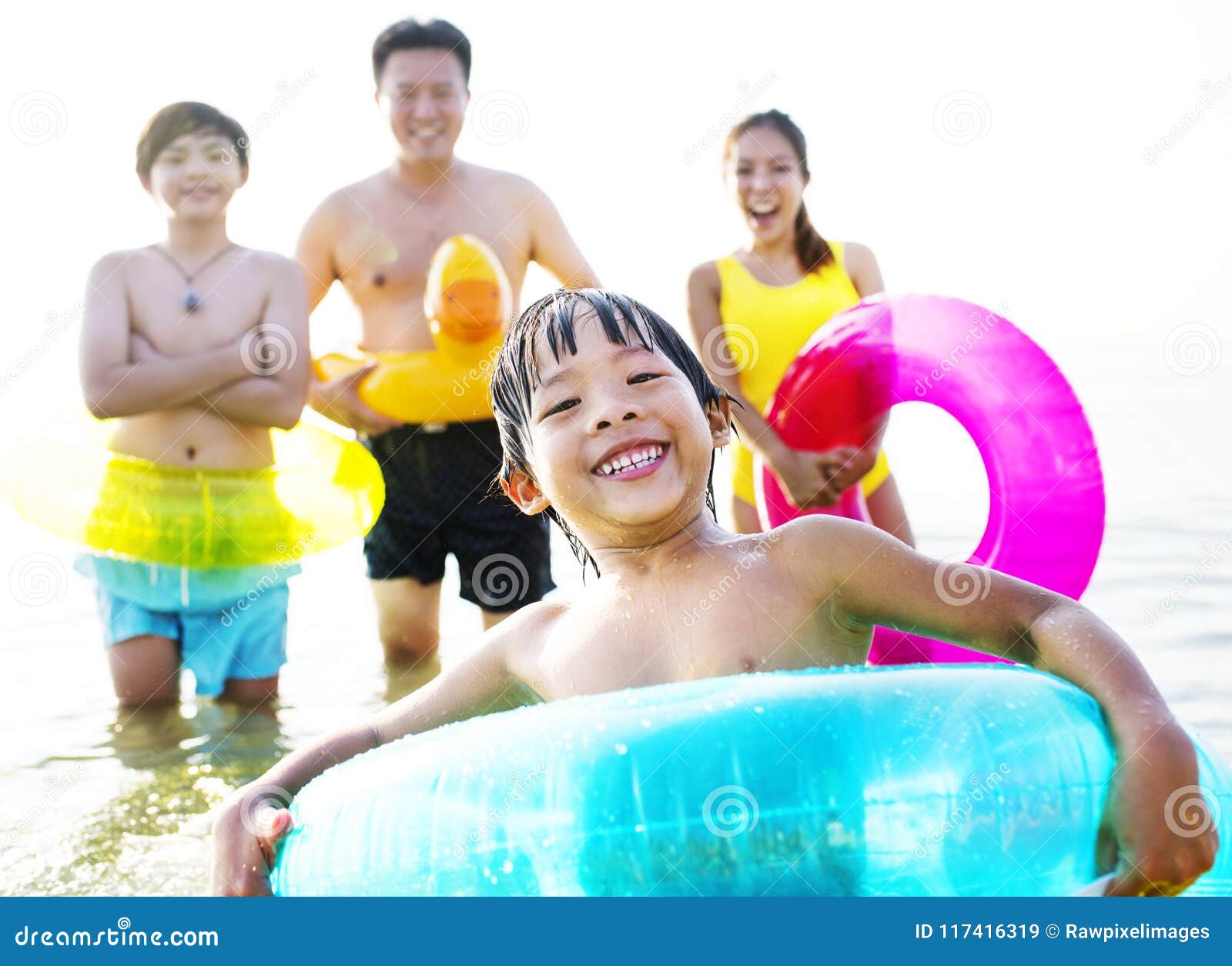 A Cheerful Kid in a Float Tube Swimming Stock Image Image of shore