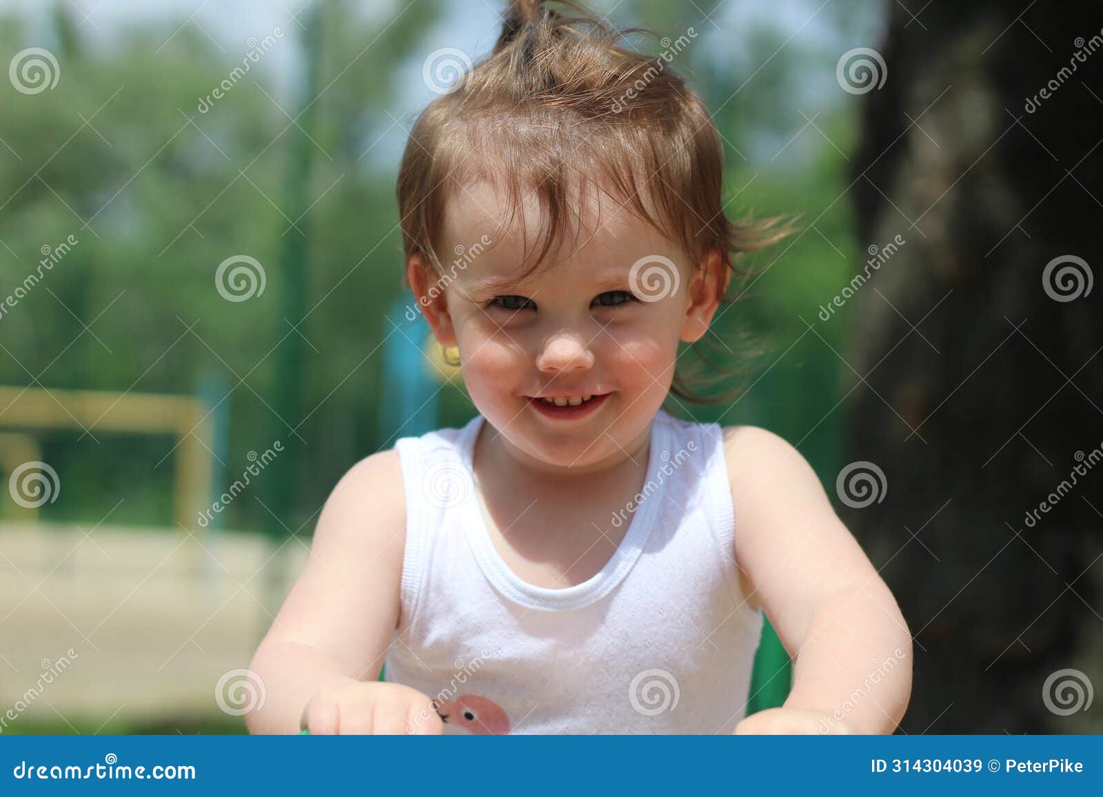 cheerful little child playing on the playground. exuberance and vitality of a child enjoying themselves. various activities and