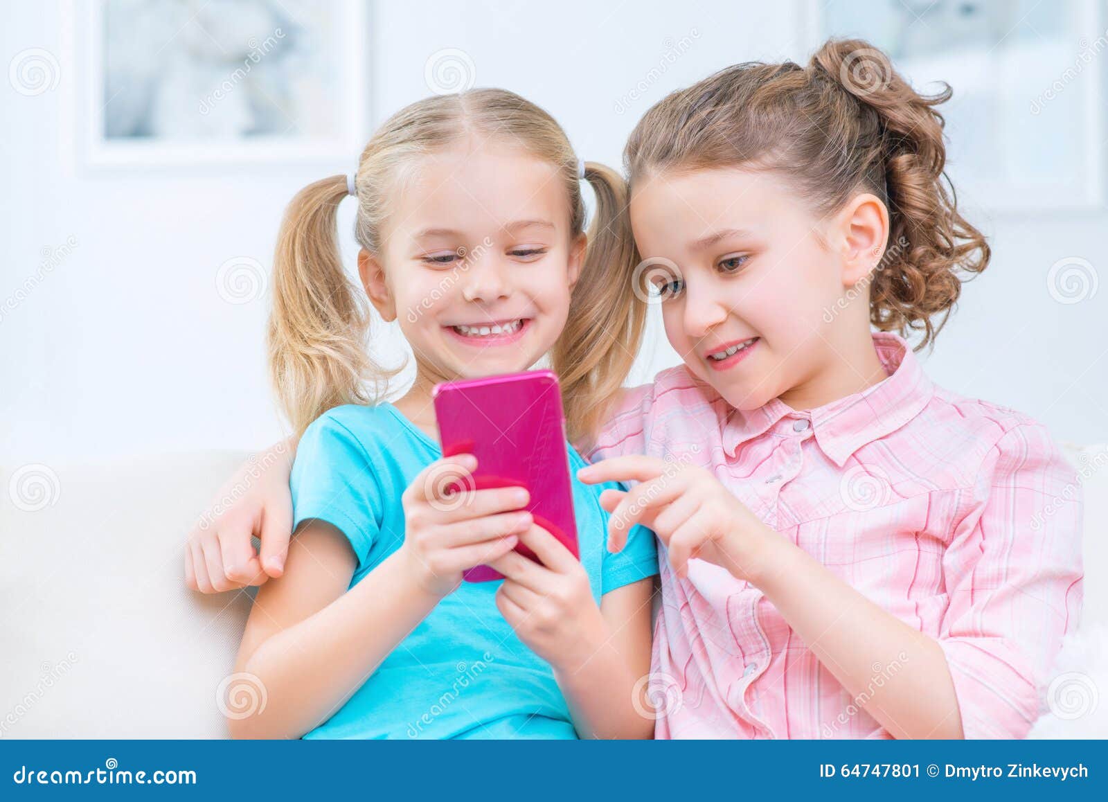 Cheerful Little Sisters Sitting on the Sofa Stock Image - Image of ...