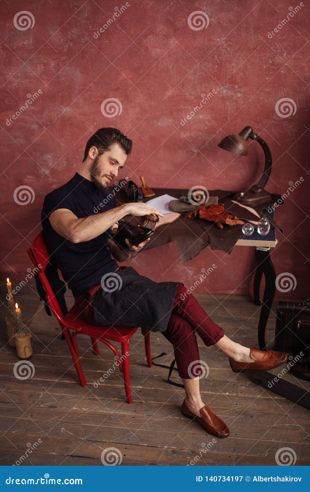 Cheerful Man Sitting On The Chair With Crossed Legs And