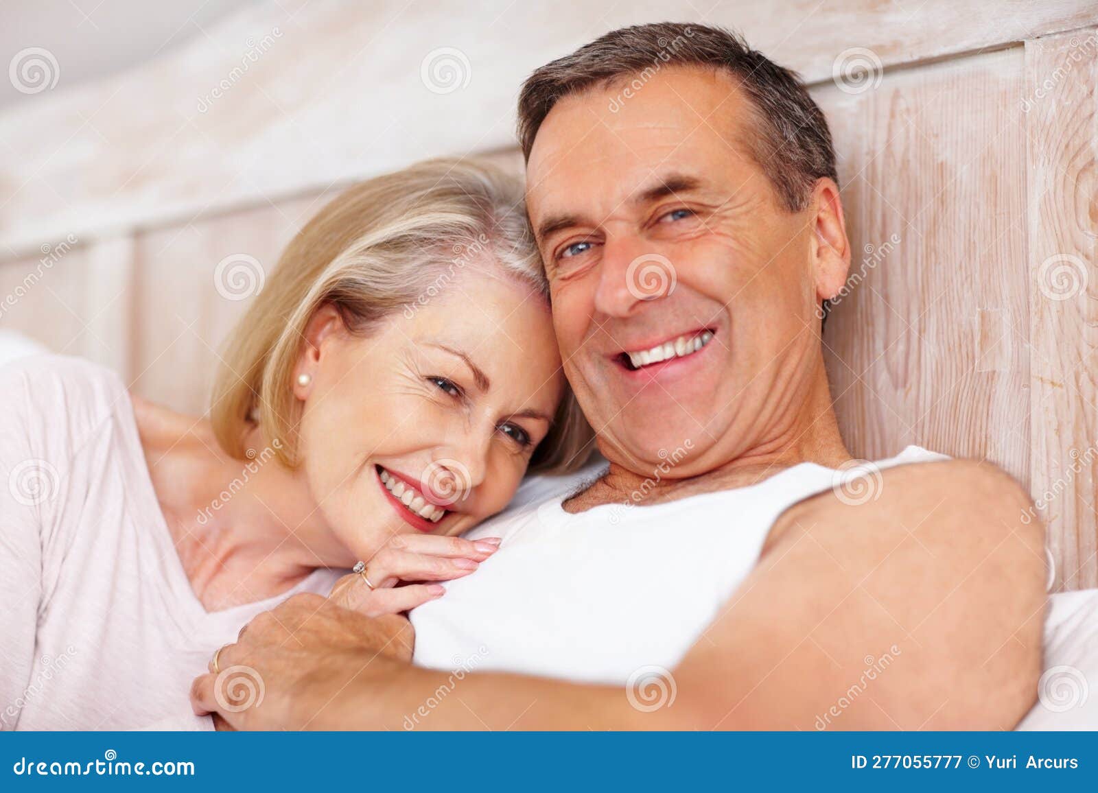 Cheerful Mature Woman Resting On Husbands Chest Closeup Portrait Of A Cheerful Mature Woman