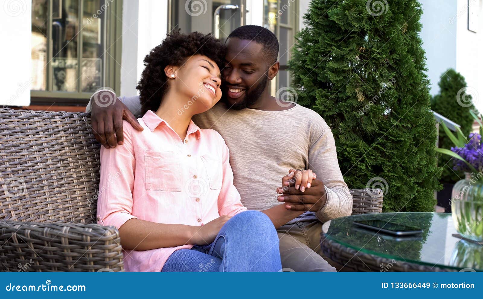 cheerful man and woman enjoying romantic date, sitting at cafe, relationship