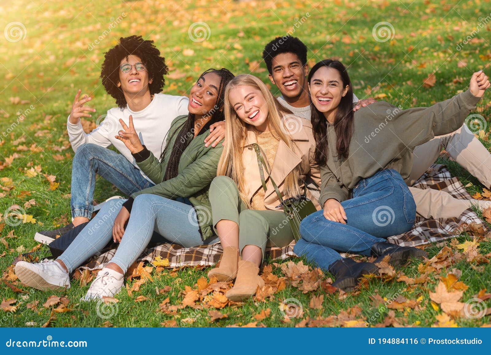 Cheerful Multiethnic Group Of Teen Friends Having Fun Outdoor Stock