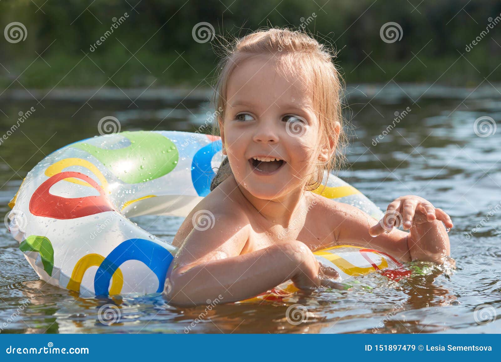 Cheerful Playful Littl Girl Swimming with Help of Swimming Circle ...