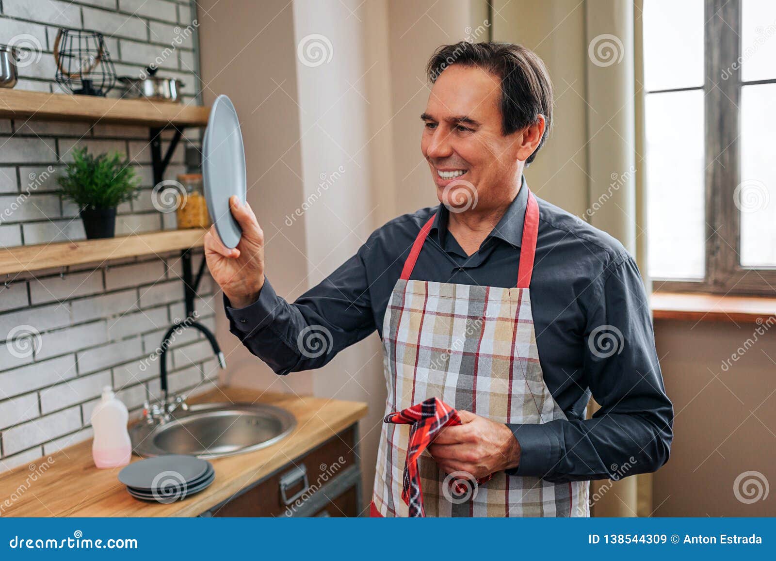 Cheerful Positive Man Stand Alone In Kitchen He Old Plate And