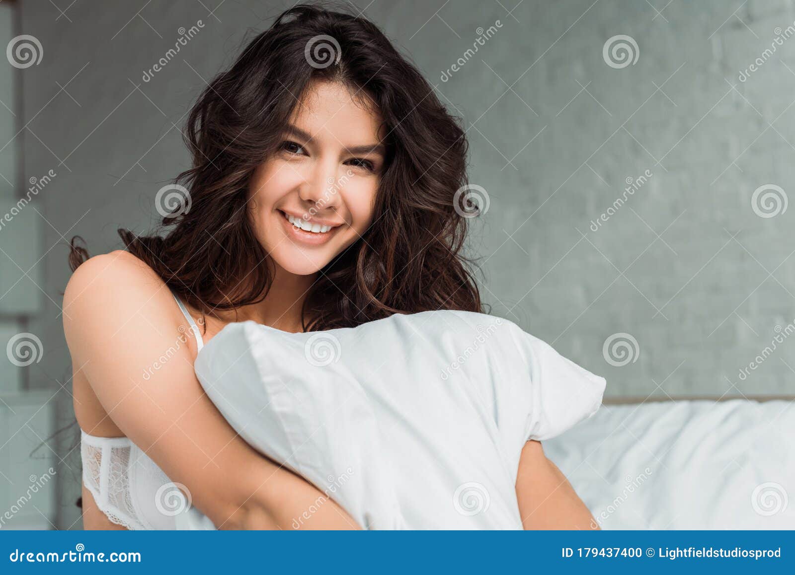 Sexy Girl Smiling And Pulling Bra Straps Isolated On Pink Stock Photo,  Picture and Royalty Free Image. Image 147441036.