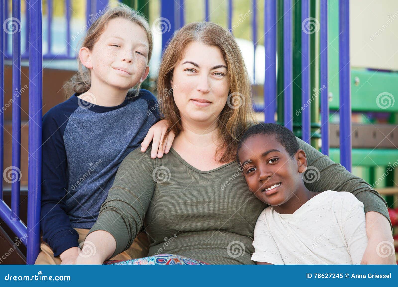cheerful single mom with sons outside