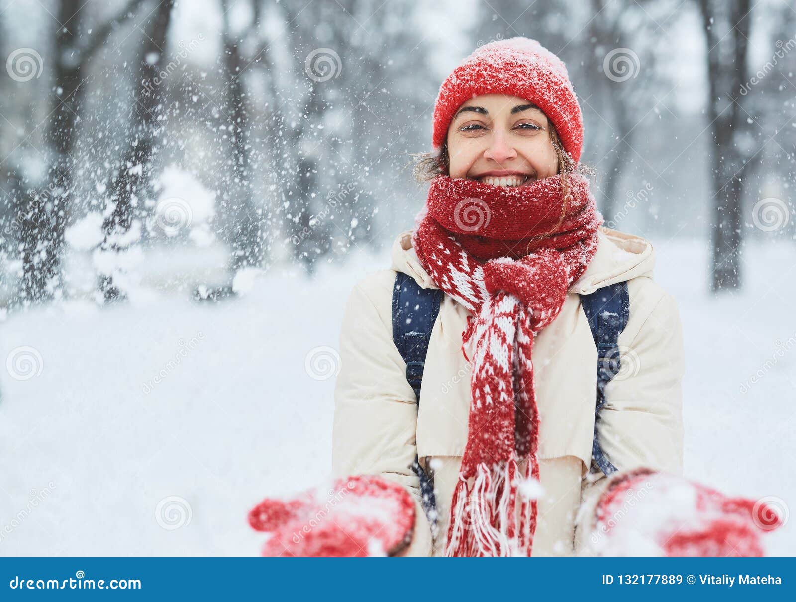 Cheerful Smiling Woman in White Down Jacket and Red Cap, Scarf and ...