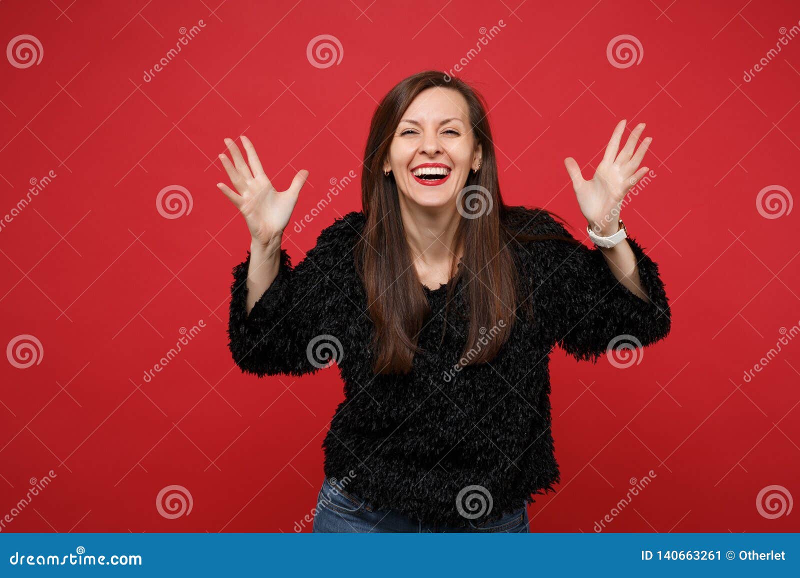 Cheerful Smiling Young Woman In Black Fur Sweater Standing And
