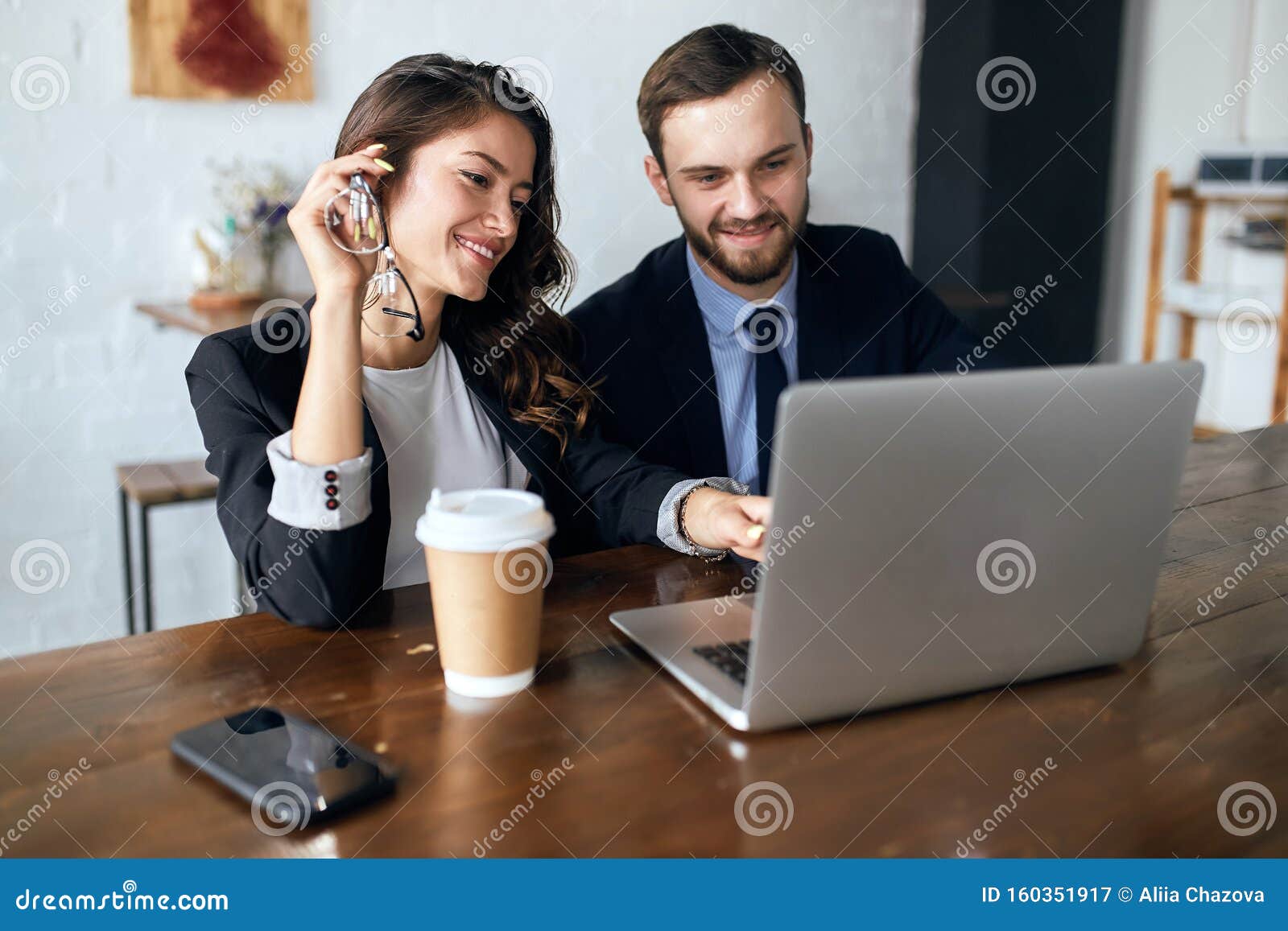 Cheerful Woman and Handsome Man in Elegant Suits Watching Funny Video Stock  Image - Image of meeting, shop: 160351917