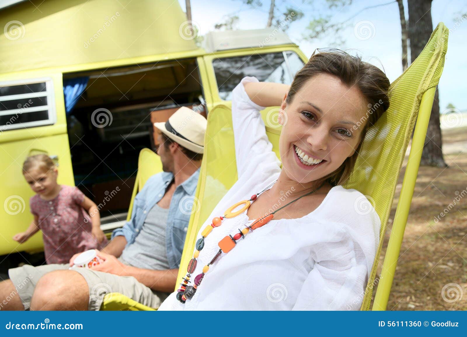 Cheerful Woman Relaxing on Long Chair in Camp Stock Photo - Image of ...