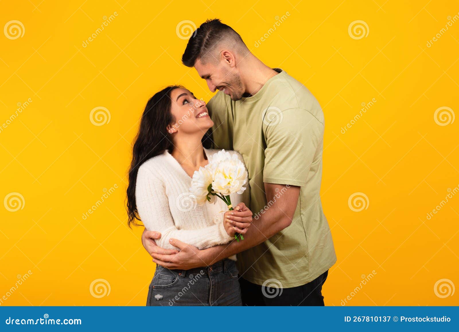 Cheerful millennial latin, arab women in underwear hugs, isolated on beige  background Stock Photo by Prostock-studio