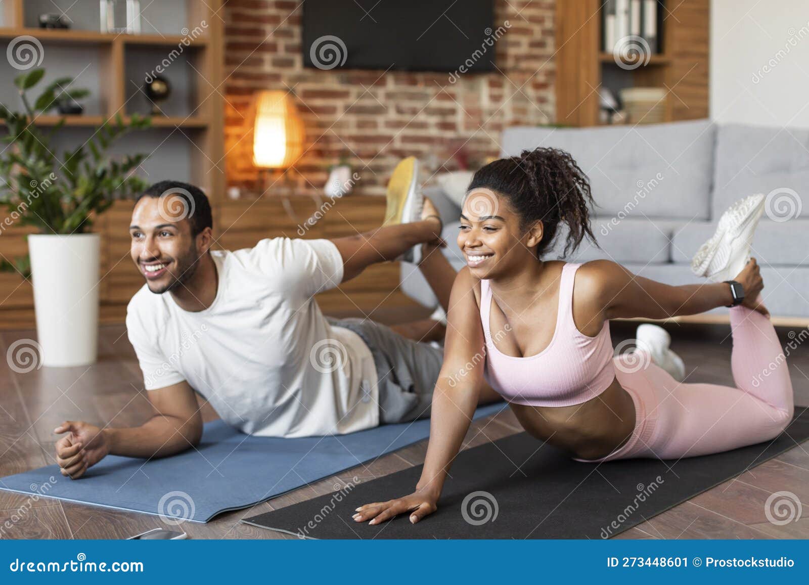 Cheerful Young Black Family in Sportswear Doing Leg Stretching Exercises on  Mat on Floor, Enjoy Workout Stock Image - Image of stretching, interior:  273448601