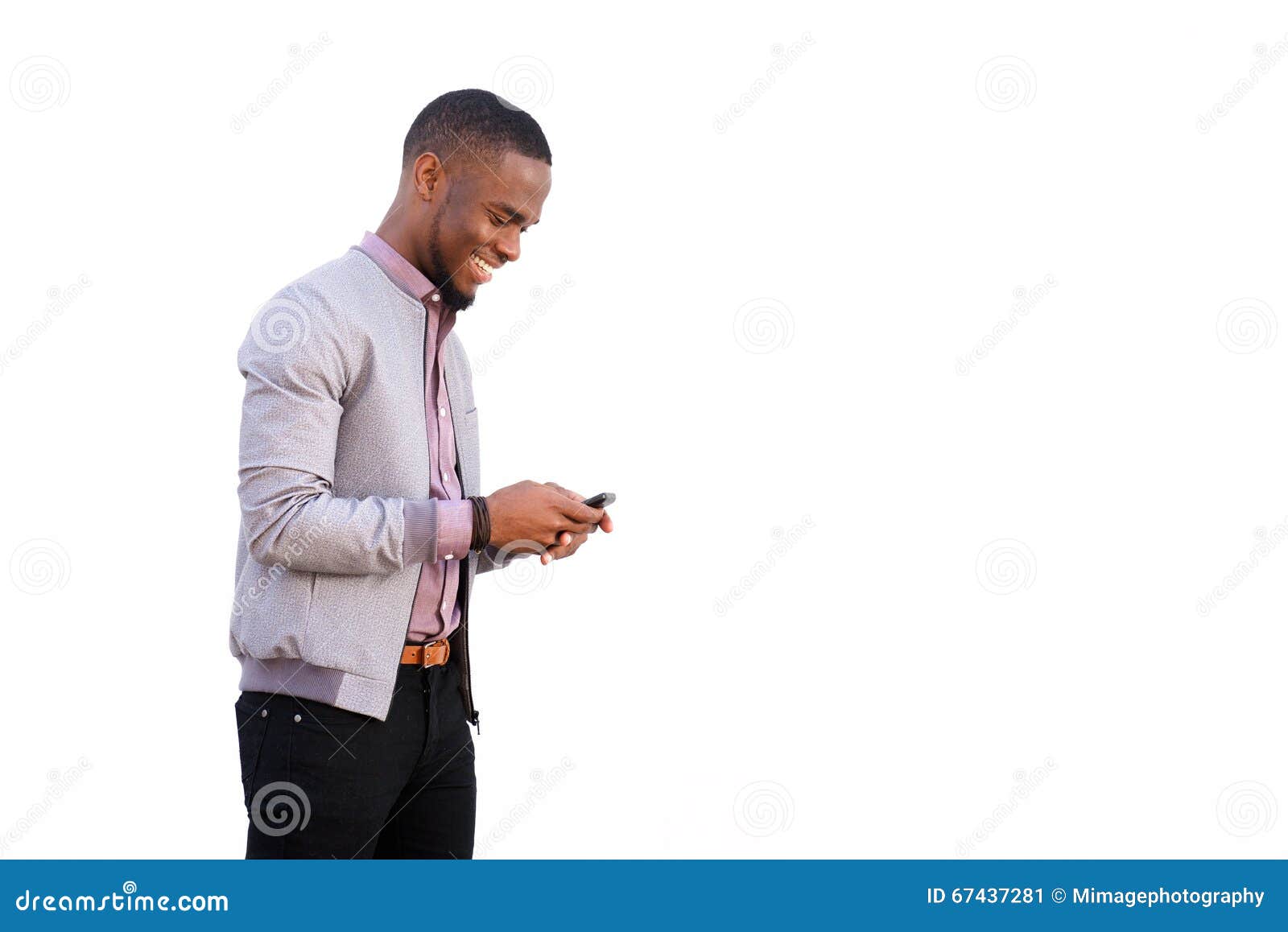 cheerful young black guy sending text message